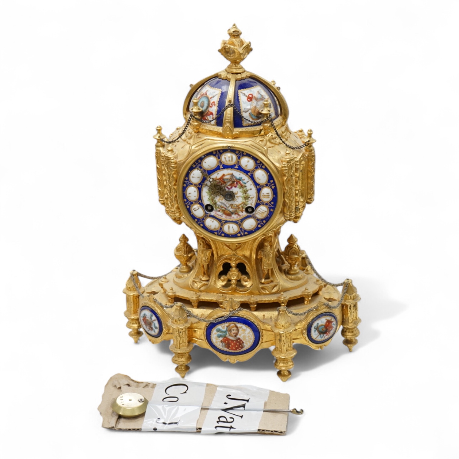 A late 19th century French ormolu mounted clock with enamelled dial and roundels depicting heraldic scenes, the dial inscribed Edward Bright, Paris, with pendulum, no key, 34cm high